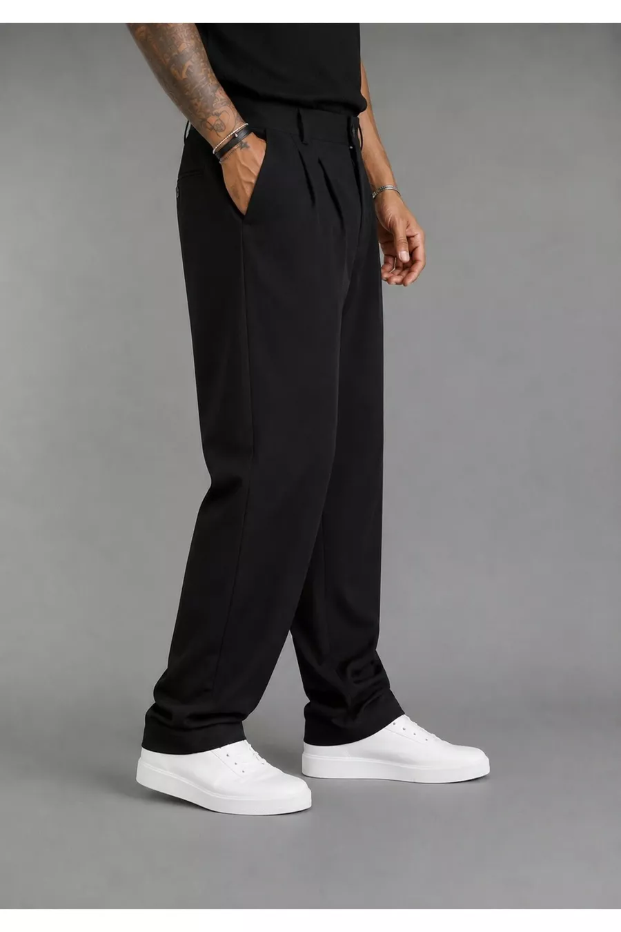 Pantalon large pour homme, coupe baggy, flexible et fluide, avec détails plissés