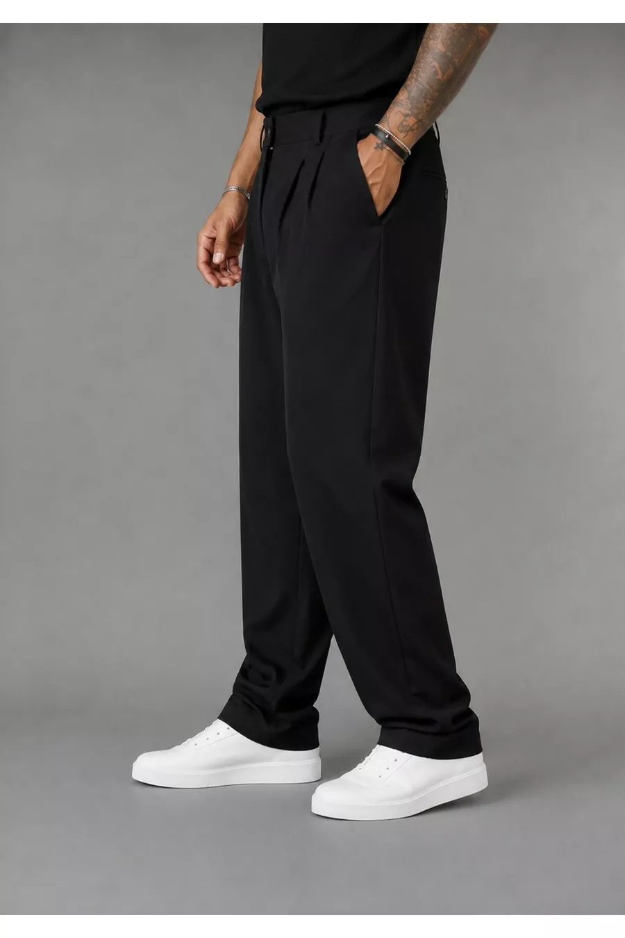 Pantalon large pour homme, coupe baggy, flexible et fluide, avec détails plissés