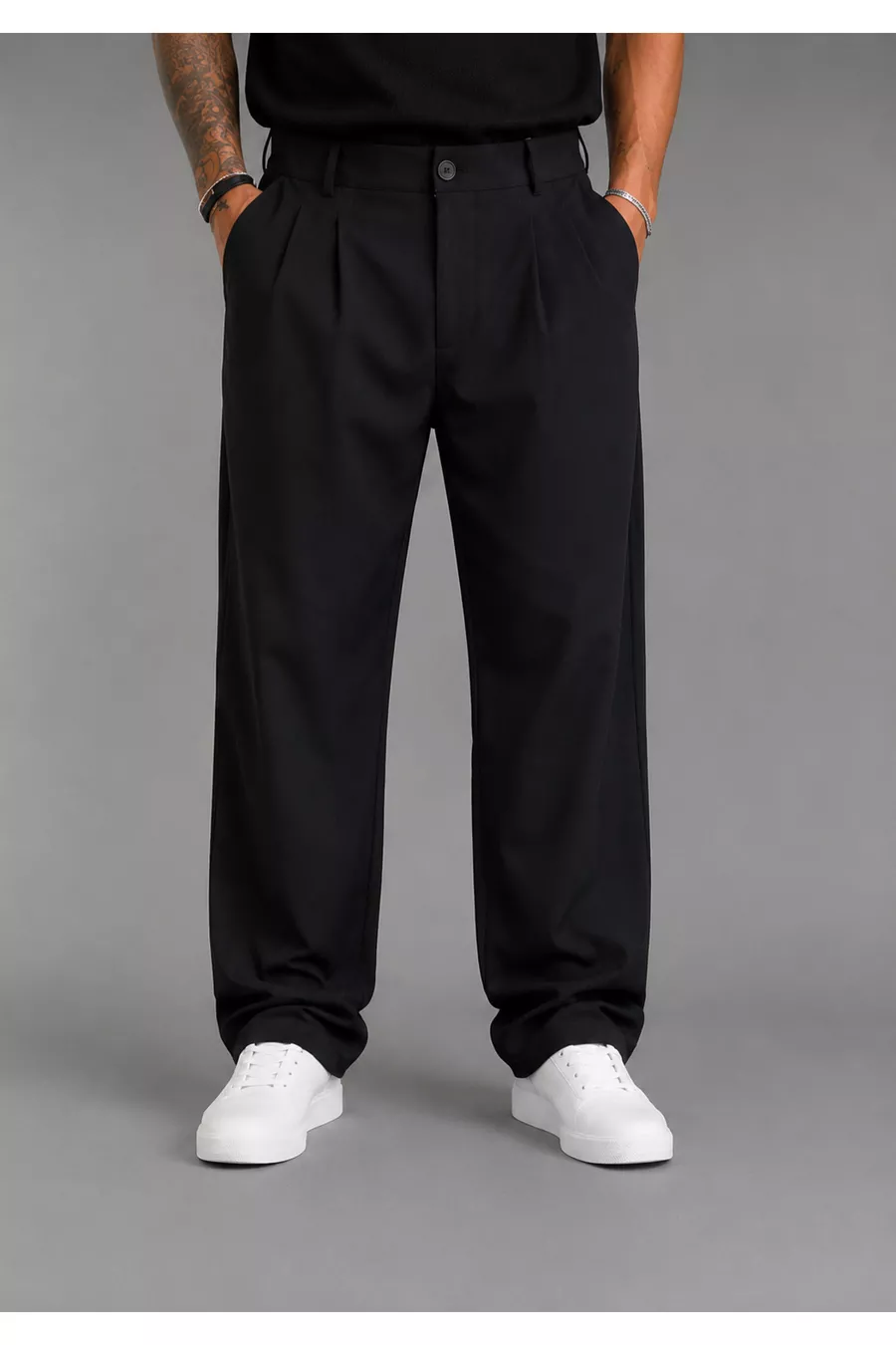 Pantalon large pour homme, coupe baggy, flexible et fluide, avec détails plissés