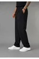 Pantalon large pour homme, coupe baggy, flexible et fluide, avec détails plissés